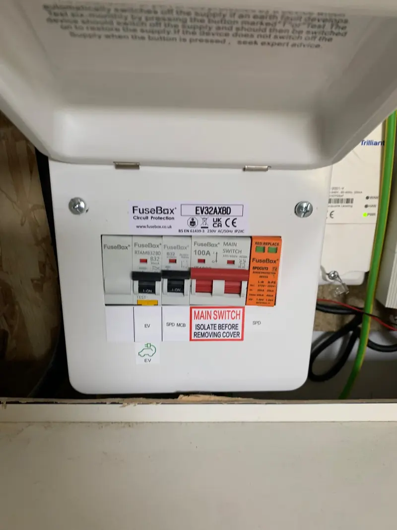 A FuseBox EV supply board with the cover open, showing the dedicated protection for a charger circuit